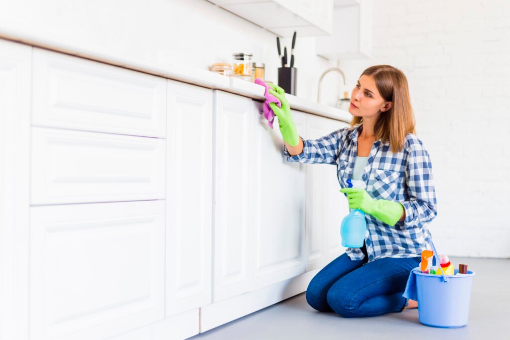 cleaning kitchen cabinet